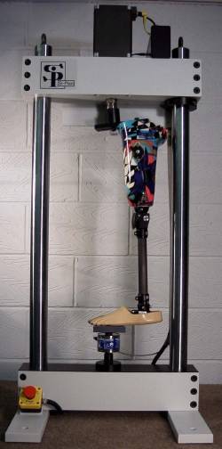 5kN servo-pneumatic test machine configured to test a prosthetic lower limb